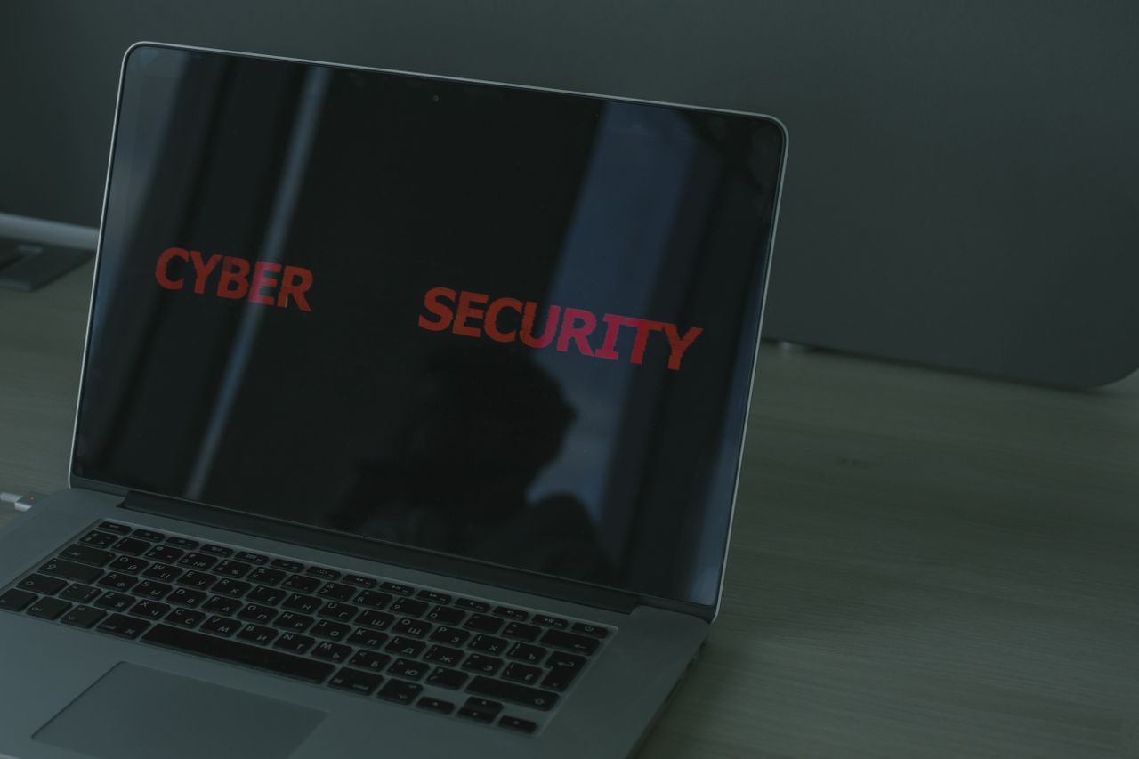 A laptop screen showing the word cybersecurity, representing the decision of whether built-in antivirus is enough or a second security layer is needed